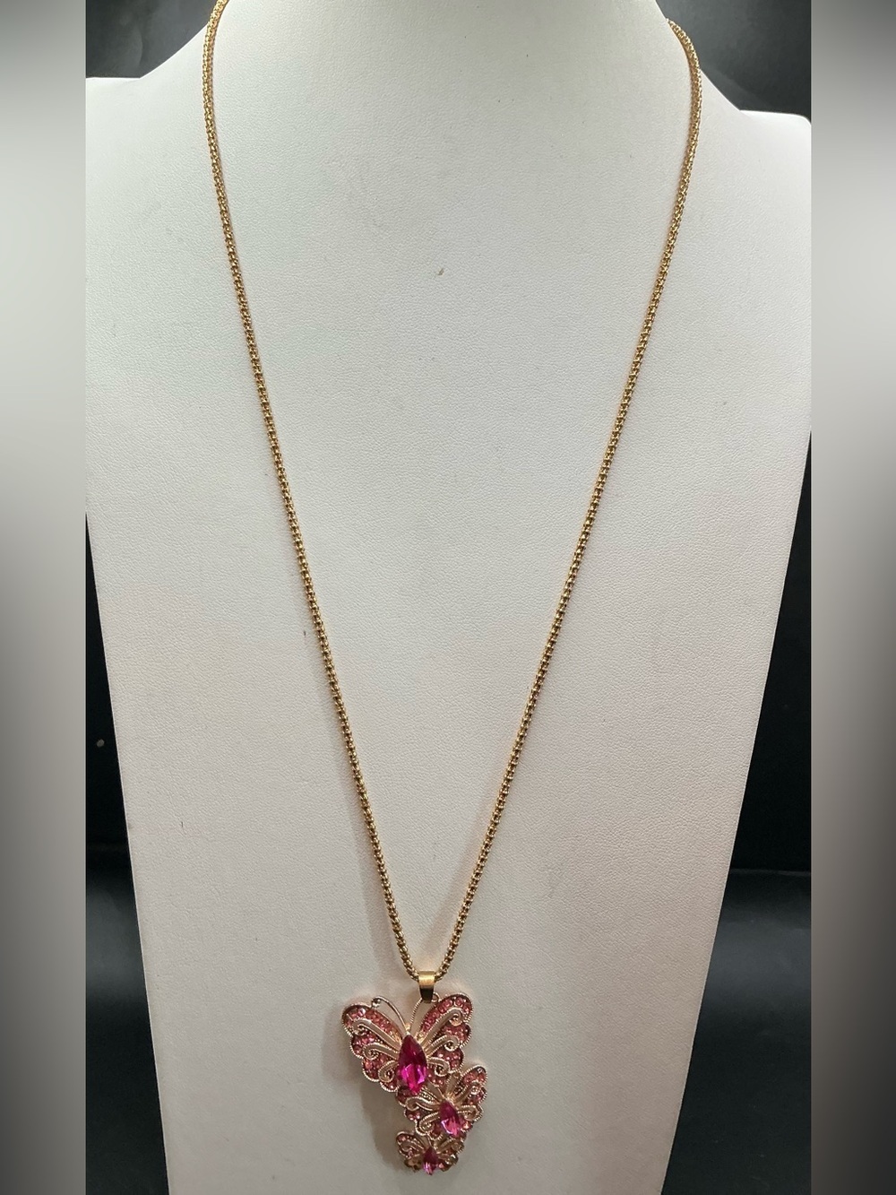 BETSEY JOHNSON GOLD TONE STACKED BUTTERFLIES NECKLACE WITH PINK CRYSTAL ACCENTS